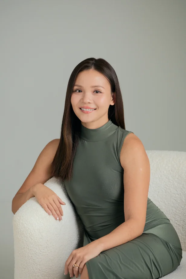 Vanessa Lim reviewing property figures at her desk